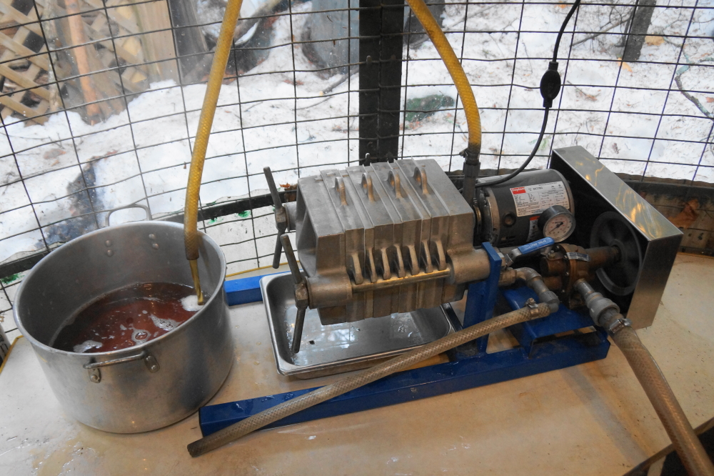 Eventually the boiled sap made it to syrup. The final pilgrimage was through a plate filter and into bottles