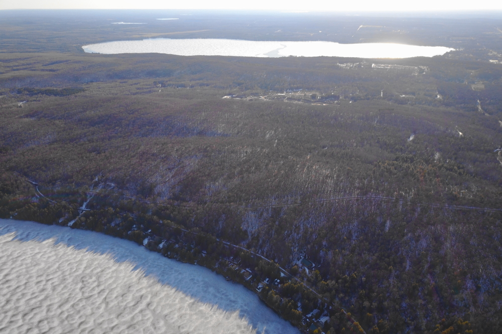 By Sunday evening, there was evidence that the sheets were starting to move. I don't think the ice covering Lake Metonga will make it to next weekend.