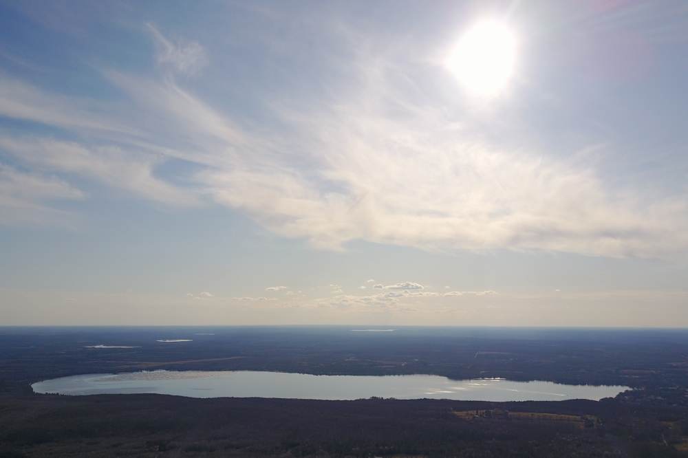 As the sun set on Sunday, Metonga had just a puddle of ice in the southwest corner and a boat zooming around the North end.