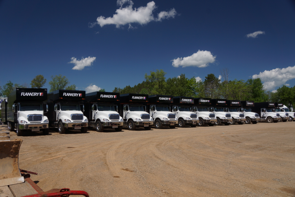We are not sure what's up at Flannery's Crandon lair, but it involves an armada of shiny, well logo-ed trucks with huge trailers.