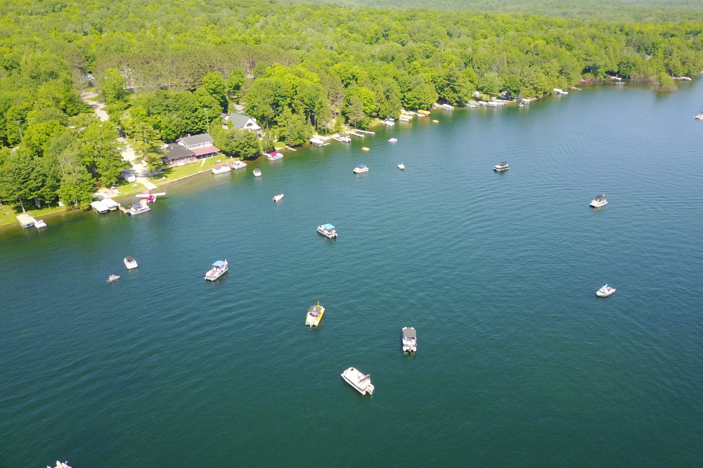 During the week, word went out that there was to be a boat parade on Lake Lucerne starting at Water's Edge at 10:30 AM Saturday. Decorated Watercraft began to gather in the bay at around 10.