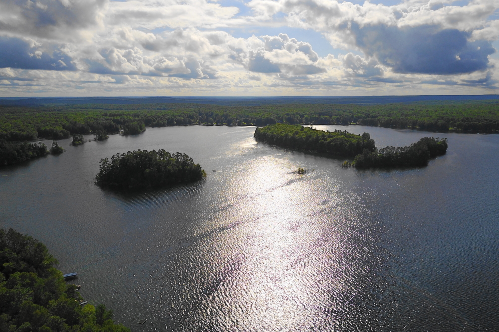 With the lake at an all time high plus three inches and inflows, we flew the drone south to the islands to see if they were still above the water or just new, albeit big, cribs. They were still there above the lake.