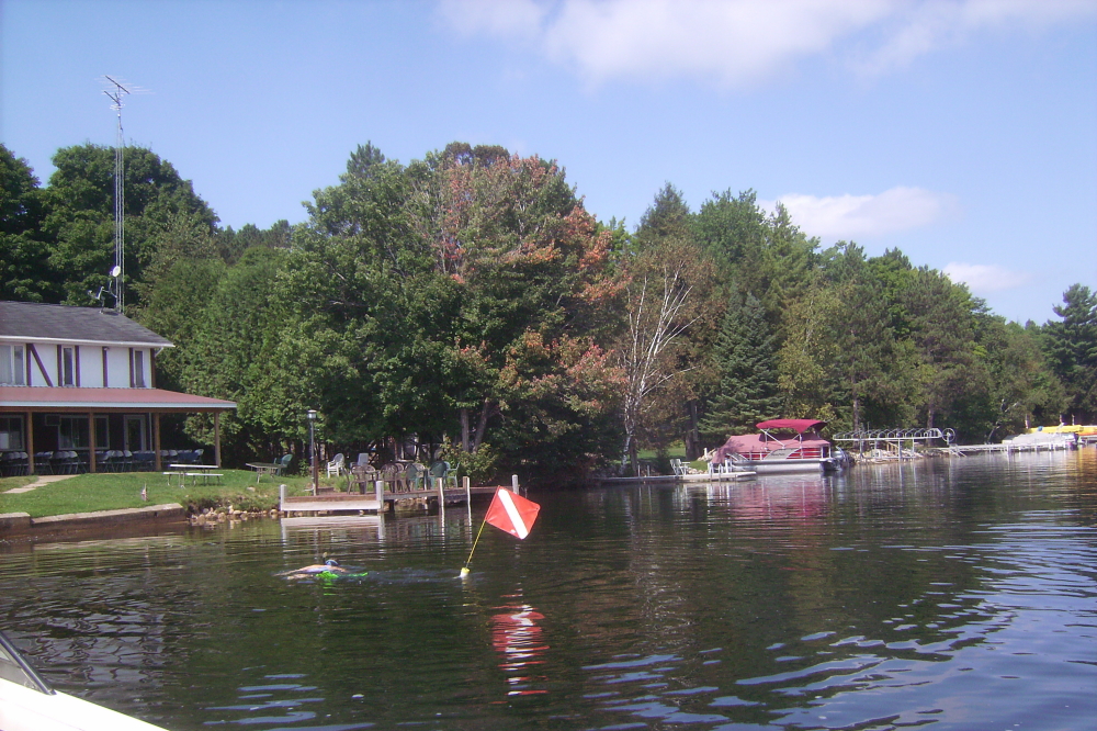 The last dive for stuff that fell into the lake during the ski show was held later in the week. Our target was a rainbow clown wig that fell off at the end of the act.  We found several items including a fork from the dining dock (the fork was returned to Waters Edge), but no wig. We found out later that the wig had floated back to shore and was probably thrown away. This surprised no one in that it was a uniquely ugly wig. 