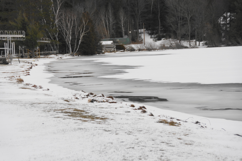 A mid-week thaw enslushened roads and filled edges of the lake with melt water.