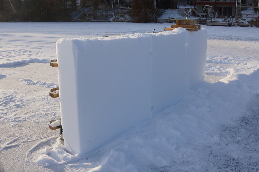 The snow on the lake is a little light this year. The snow miners dug up enough ore to refine it into a front wall.