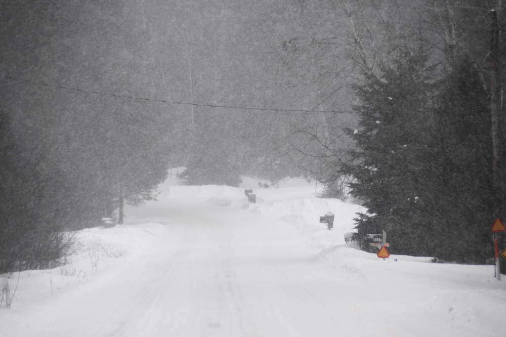 Under the fresh white is just under an inch of hard, cold ice. Under that, we think we remember an asphalt road, but it's been so long we're no longer sure.