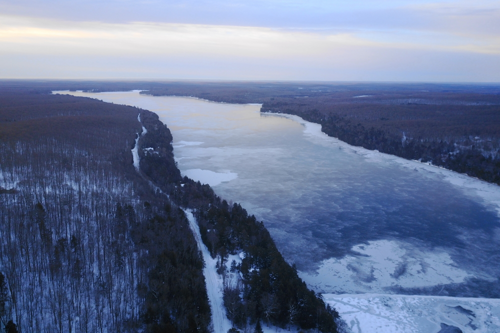 At the start of last week the temperatures plummeted. Seemingly overnight, the lake went from "very open" to "almost closed". It looked like the open water might stay that way into Wednesday. It's uncommon that any open water freezes up during the "heat of the day". There was nothing that remotely resembled "heat of the day" on Tuesday. The single digit highs of the day before Wednesday would have the last word.