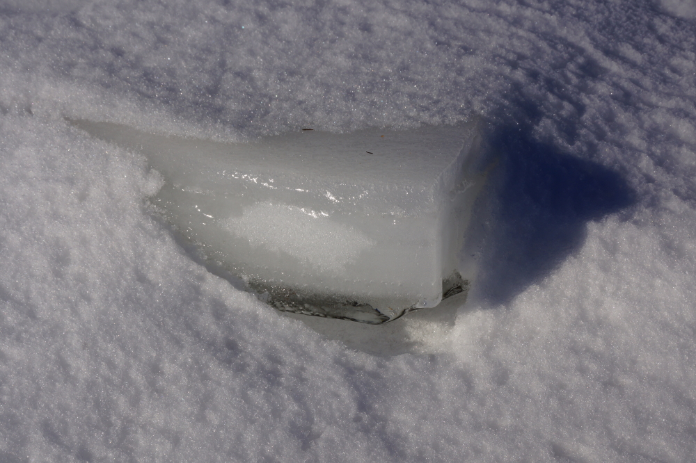 The previous week's wind storm had broken up some of the ice on the North end, but the small open spots froze over pretty quickly. To avoid the ice slab that was formerly called Knott Lane, I chose to walk on the snow covered lake ice along the shore.