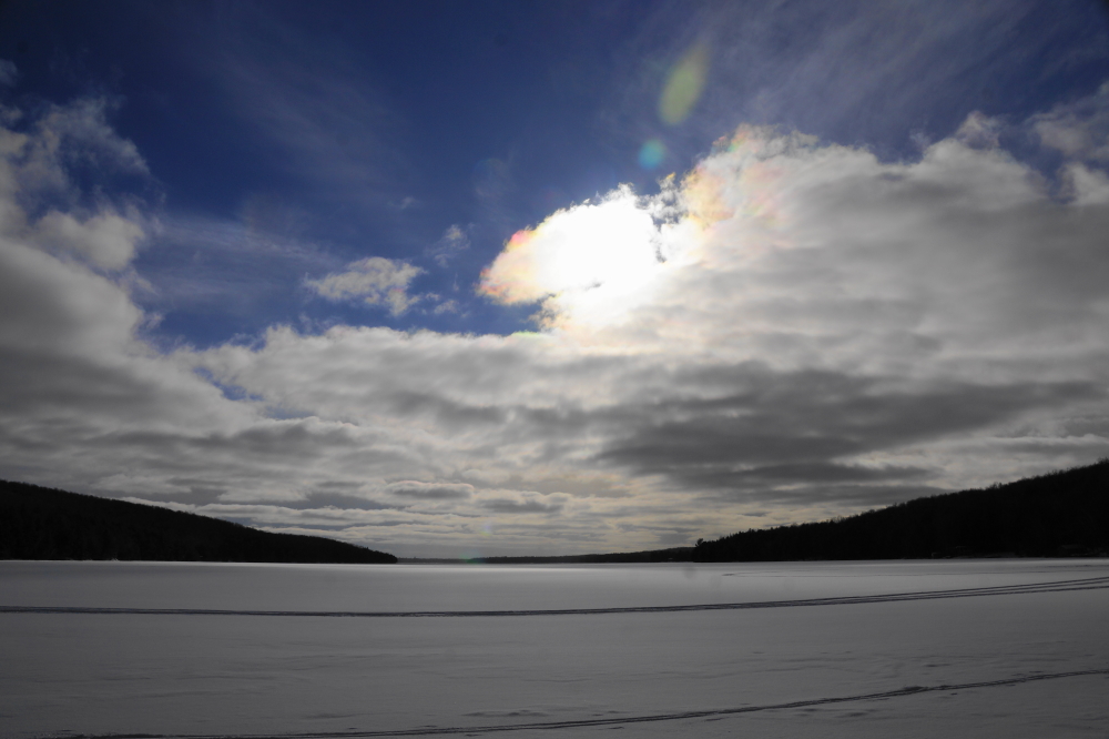 It's cold outside. Such words have been expressed in the past, but it's cold enough out to reiterate. Emphatically reiterate. We didn't get an ice thickness check last week, but judging from the snowmobile traffic, we'd say it's pretty thick. Or at least thick enough. We did acquire ordnance for the upcoming Annual Lake Lucerne Bottle Rocket War. I would expect the 3000+ rockets to be expended in less than half an hour if we can keep the war time temperature above the boiling point of propane (-43.6°F). If you can't attend the event, we'll get the links up to watch a live view (better than the webcam with sound and all the trimmings) in a week or so.<br><br><br>-Nemo, behatted and giving squirrels a pass during extreme cold.