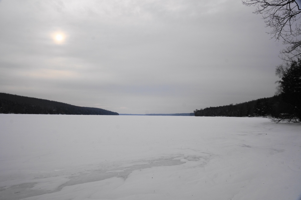 With the warm came the gray. The sun has been obscured by clouds since pretty much mid-week. In addition to smothering the sun, the warm has thinned the snow a bit and paradoxically thickened the lake ice. And really thickened the road ice. Walking outdoors has become less of a prelude to adventure and more of a gymnastic event in itself. Unless you attach big honking spikes to the bottom of your boots. Then it's safe (and fun!) to openly taunt the thick,  smooth, and contusion-y road ice.  In the next two weeks,  to build forts for this year's Annual Lake Lucerne Bottle Rocket War, we could use a little more snow. About 4 inches would be nice. If past historic weather trends mean anything, I'm pretty sure we'll get it and more.<br><br><br>-Nemo is starting the site survey, munition accumulation, and rampart design.