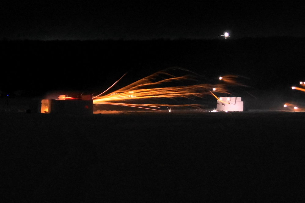 We started with over 4,000 rockets. We almost lost a 1,000 of them when a spark fell into one of the south's ammo bunkers and lit the fuses of about a dozen rockets. After a bit of excitement, the sparking ordnance was grabbed and expelled at the cost of only 2 burned fingers. It was sort of like the <a href='/WeeklySummaryPages/2013/0211/DSC08126.JPG' class ='defaultlink2' target='_blank'>Statue of Liberty shot</a> but with no Sambuca and more report. I can still type though. Shortly afterward, one of the south's torches quit. For the rest of the conflict, after loaders would fill a tube, they would call for a light from the remaining torchbearer.