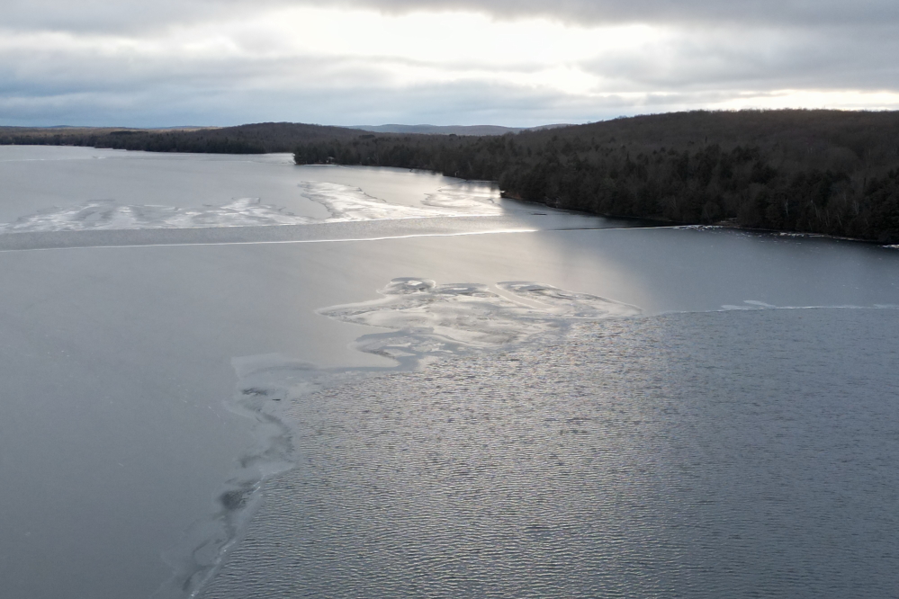 A strong wind from the north drove waves into the mid lake ice, breaking it up. The wind fell off by sunset, but the damage was done. Ice-in would not come to Lucerne in 2023.