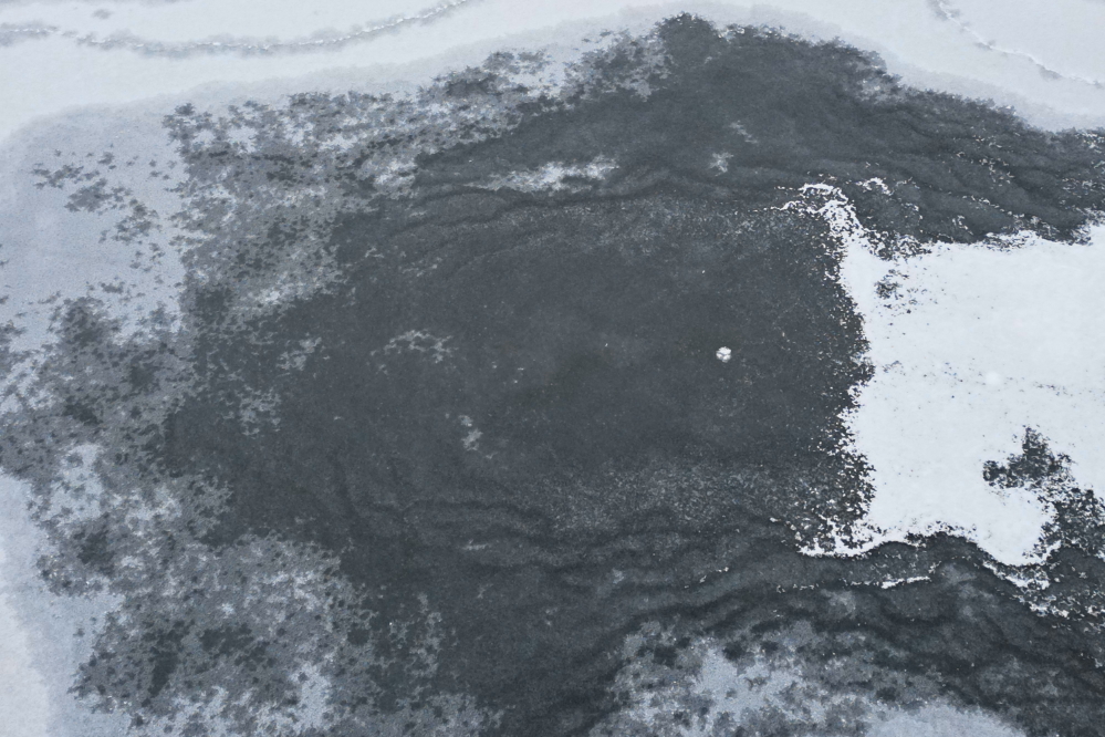 Just as the last flakes fell on Sunday, the last of the open water on the north end of the lake froze.