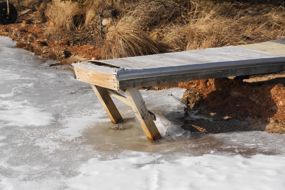 Piers that were not fully pulled from the water last fall suffered.