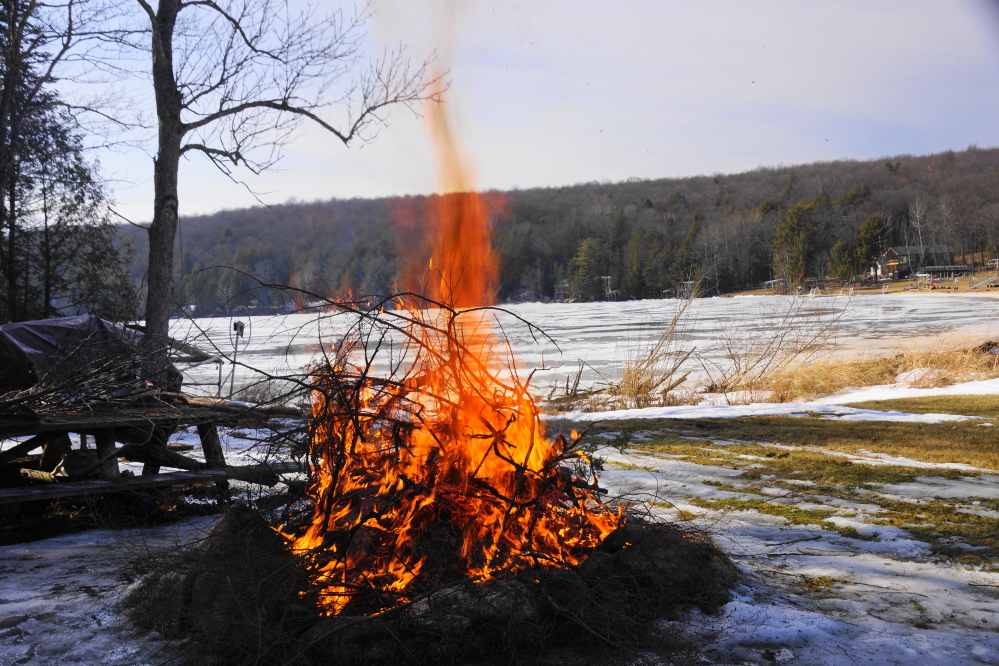 Nobody wanted to trek out onto the slick, soggy surface to get a lake ice thickness check, so we had a tiny campfire instead.