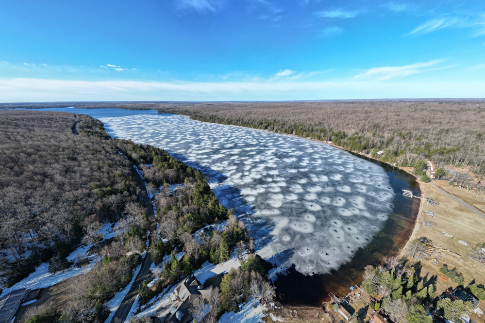 At the end of the week, the ice was in full retreat from the north shore. If not for the heaping helping of winter we got early in the week, many think the ice would have been just a cold memory by now. If April can avoid another winter convulsion, the ice will not be obstructing skiers for long. The only items that may impede skiers after the impending ice-out would be lack of a boat or a surplus of sanity (the water may be open but it'll be insanely cold). Until that first run, the golf course is open and there's always the race to get the piers, lifts, and boats in. The ice pulled away from the edge enough for a <a href='/LakeLevel/LL2.html' class ='defaultlink2' target='_blank'>lake level</a> check. The lake is up 1.25 inches since ice-in. That's down about a foot from last year. If the lake level continues to fall like it has for the last few years, it'll be at or below the nail soon. Place your piers and lifts accordingly. And no power loading at the launch!<br><br><br>-Nemo plans to get those ice-out checks mailed in the next day or two.