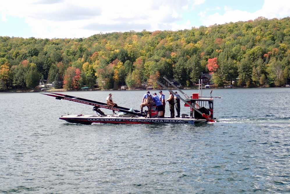 During a few days, the pontoon crane guys were spotted cruising up and down the lake pulling out lifts