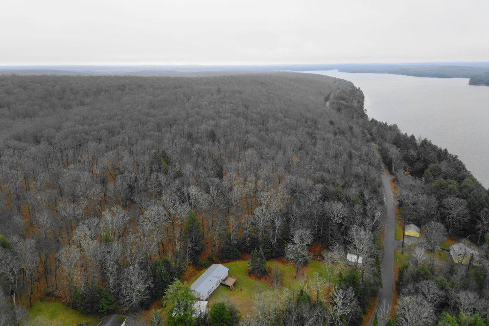 There ain't no color left in them trees. The hills around the lake have fully embraced the shades of gray color palette that precedes the white.