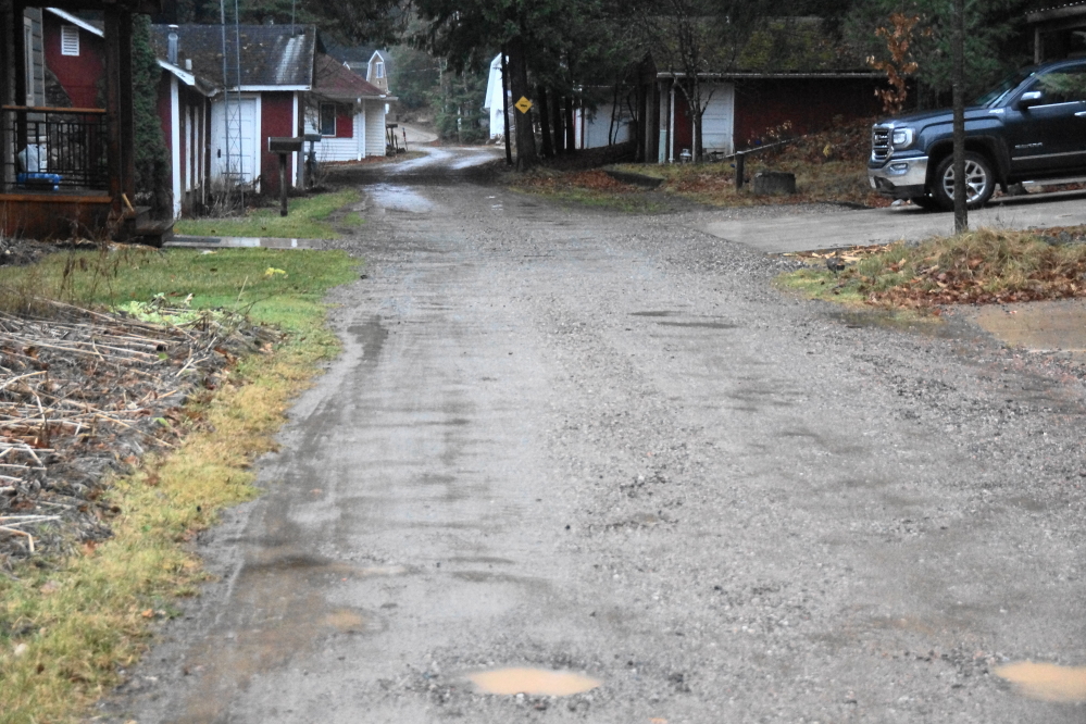Knott Lane is snow free, but if the temperatures don't stay above freezeing before the soak leaves the lane, it'll be an icy base for winter.