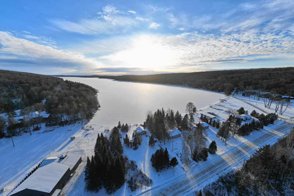The cold dropped into the sub-zero (°F) range by the weekend. Sub-zero cold is not welcome in December, but it's not uncommon. We'd like thicker ice for the 34th Annual Lake Lucerne Bottle Rocket War, and this sub-zero stint should make that happen. When the top inch or two of snow is removed from Lucerne, you can see down over ten feet. It's weird standing on a solid, clear surface above the lake bottom. A little creepy, too. The ice seems thick enough for snow-machines, but none have been spotted nor heard yet. <br><br><br>-Nemo vows no involuntary swimming this winter.