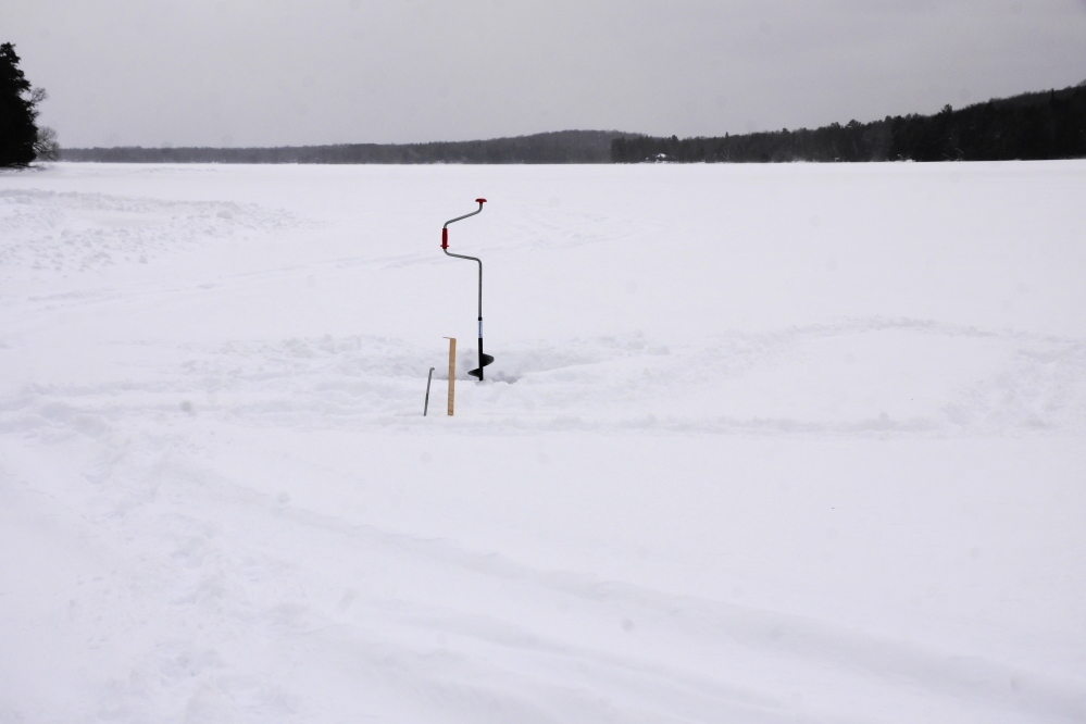 One of the last events of the week was to check the ice thickness. With 8 inches of snow covering the lake, I did not expect it to be much thicker than last week. Mrs Nemo thought it would be much thicker.