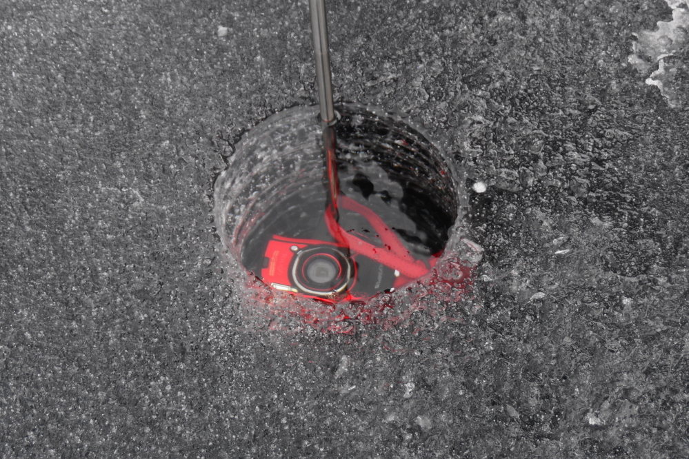 The lake ice remains unusually clear. In an effort to image its uncloudy nature, a water proof camera was lowered into the hole.