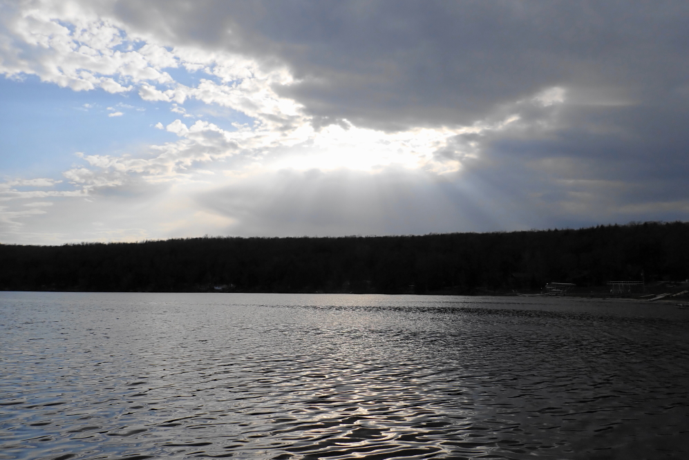 Just after bunking the pontoon, the sky started to whisper rain. Just after sunset, the clouds broke up and the lake got none.