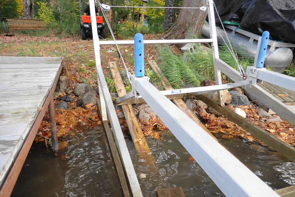 By the end of the week almost all boat lifts were pulled, pushed, or dragged onto the shoreline. Over the years, the men have gotten better at the dark alchemy of lift pulling. This fall, the task went quickly, injuries were light, and ibuprofen reserves untouched.