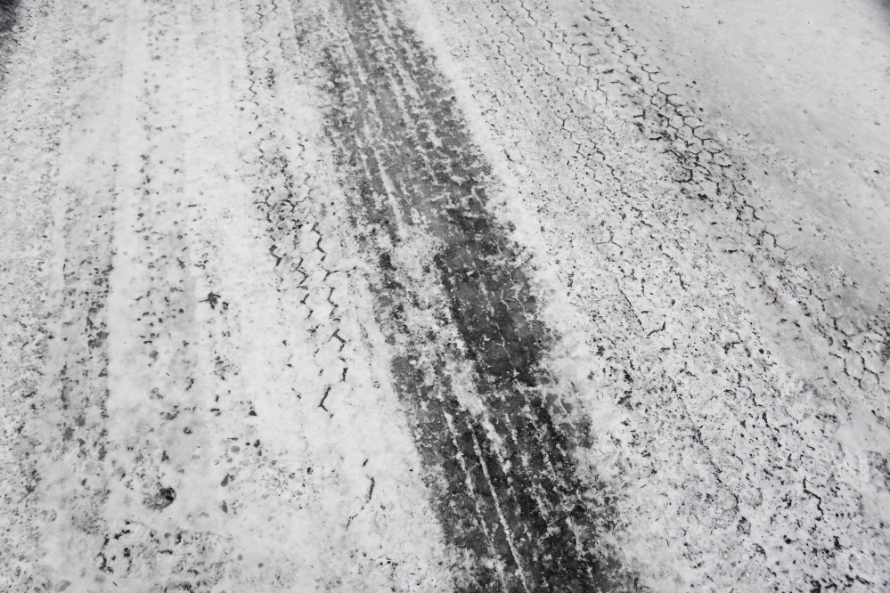 The rain mixed with snow formed a slush that froze resulting in a quarter of an inch of hard ice on untreated roads.