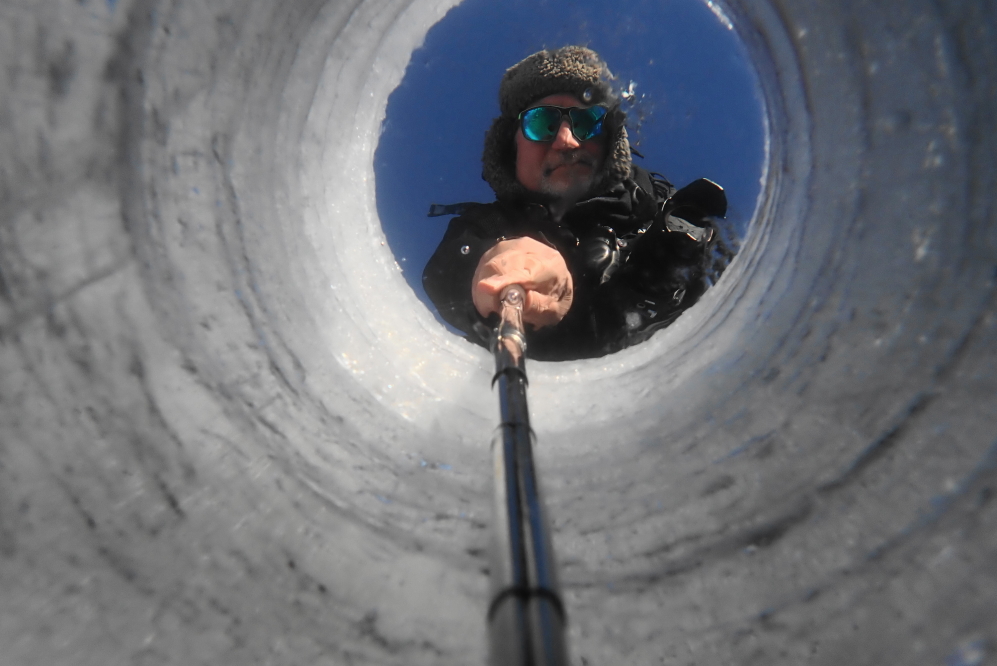The top 3 inches are a little airy. Under that layer, the ice is hard and clear. After taking off gloves to operate the underwater camera, the 7°F air stopped feeling very warm.