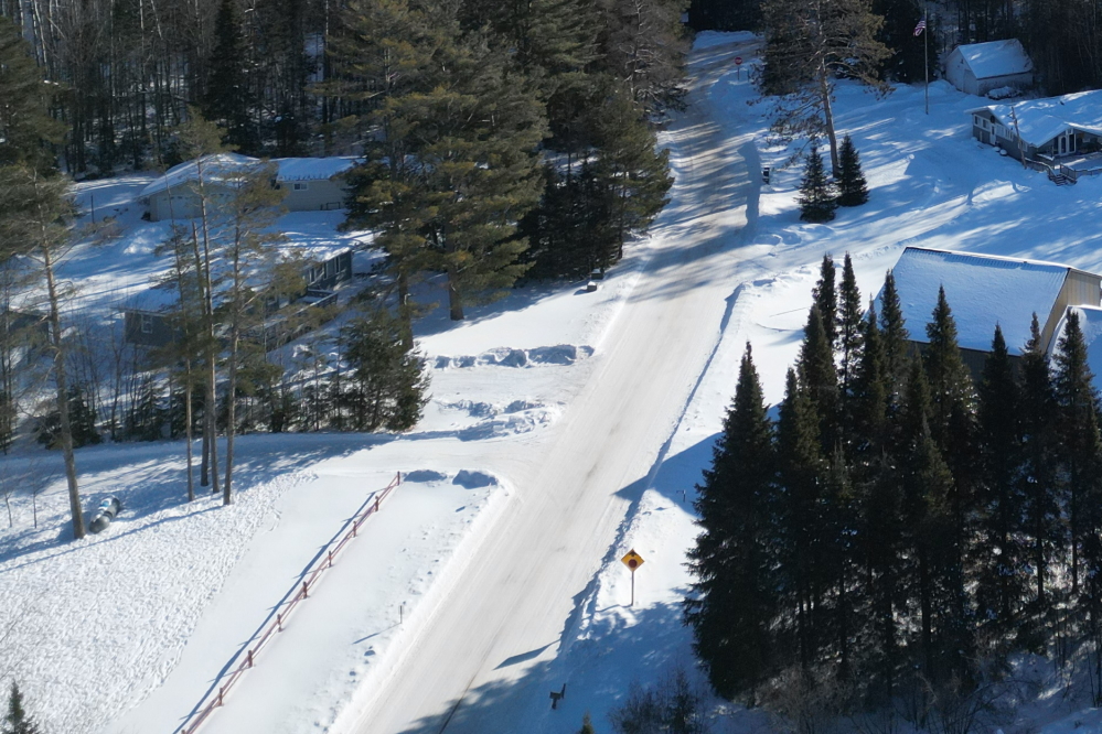 Most roads around the lake have a packed snow cover that has a  coefficient of static friction very close to that of ice.