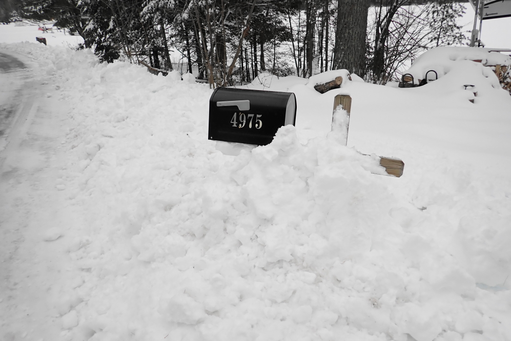 In addition to getting covered, some mailboxes were taking abuse from waves of snow kicked up by passing plows.