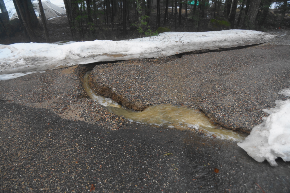 The north end of Knott Lane is passable if your vehicle has really big tires. The plan is to fix the north end's chasm soon.