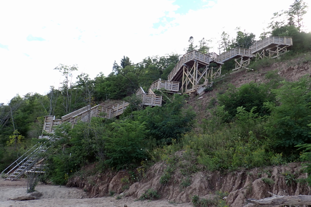 The stairs look like a long and rambling piece of art from the beach. It was noted that going down does not increase the heart rate or the leg numbness that going up 'em does.
